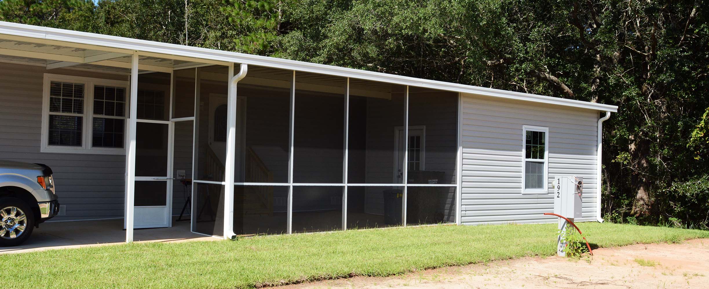 Custom designed and built car port, sunroom and screen room in Foley, Baldwin County, Alabama